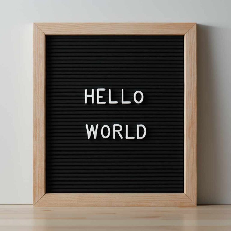 A letter board with Hello World written in removable letters
