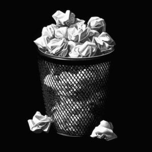 Waste basket with paper representing the adverb overload detector