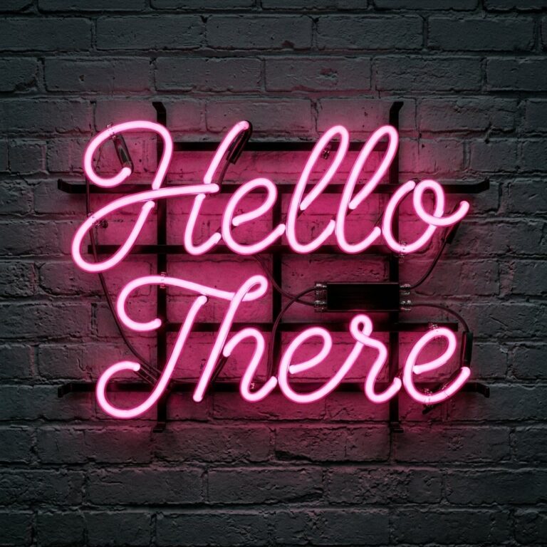 "Hello There" written in hot pink neon tubes.