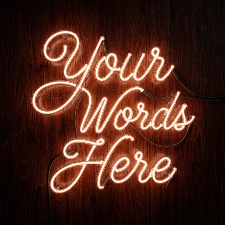 "Your Words Here" written in amber/orange neon tubes.